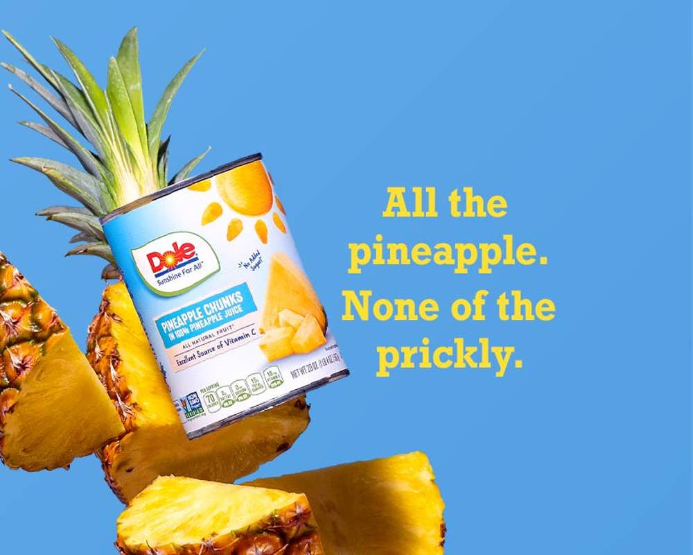 pineapple can with half-pineapple behind