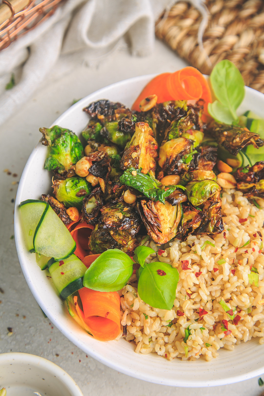Kung Pao Brussels sprouts over rice with veggies.